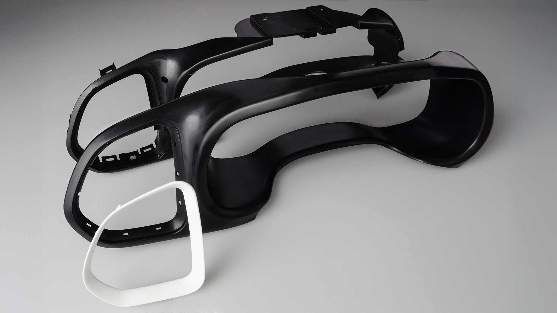 Instrument screen and mount. Prototypes and pre-production models were injection molded using aluminum tools. AM was used in the form of SLS to check the design and to test the assembly. Image: Cirp