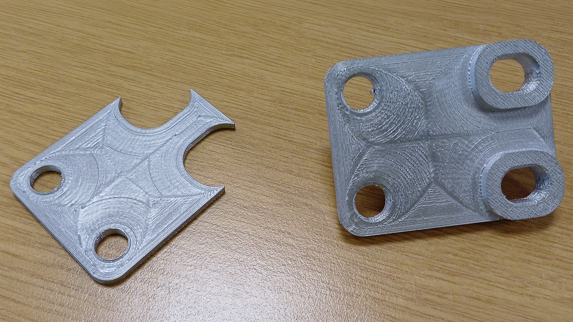 Another Challenger 3 prototype production part – printed using Metal Paste Deposition in 17-4PH stainless steel. Left is the metal support, right is the underside of the part after hand removal of the support. Image: RBSL